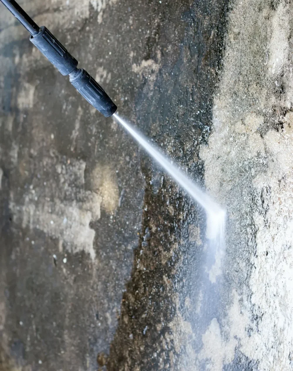 Saval UK technician removing limescale from a glass facade