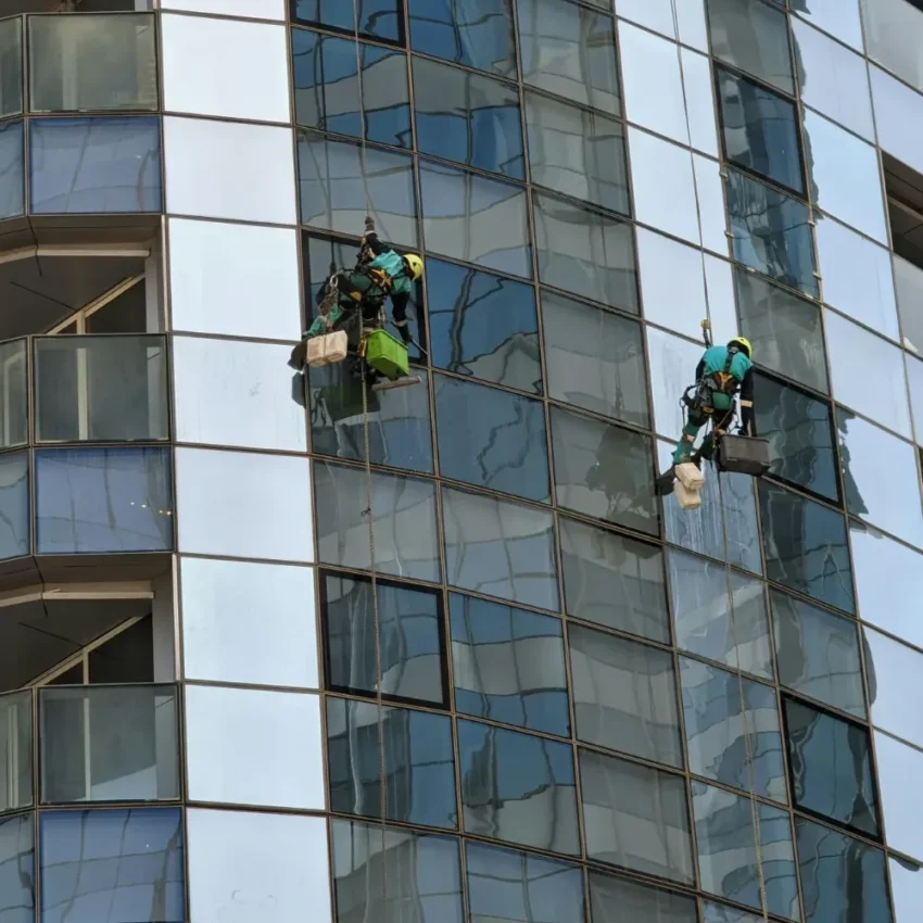 Abseiling Window Cleaners working on a tall building