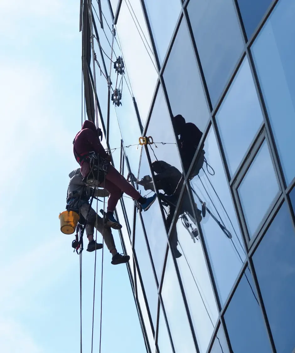 Glass facade cleaning rope access