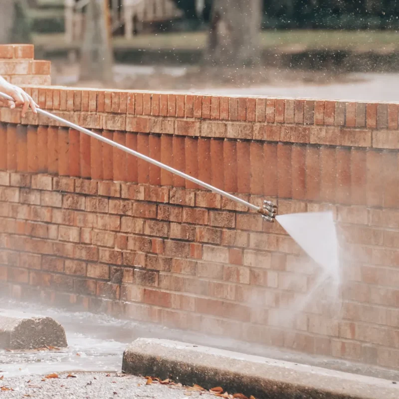 Pressure washing brick facade