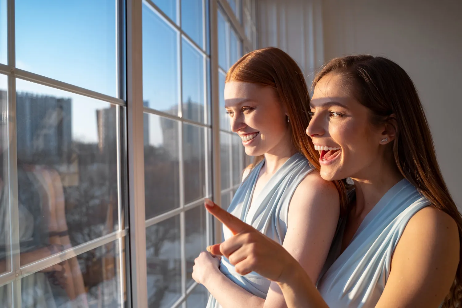 hotel guests smile and enjoy looking out clean windows
