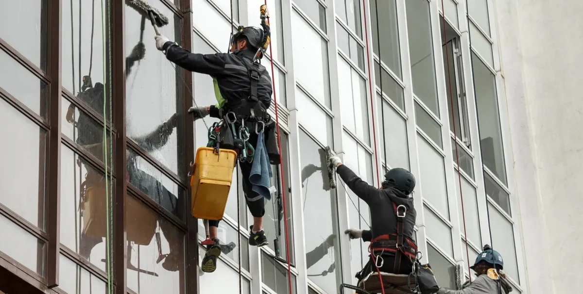 Saval UK abseilers cleaning high-level windows on a London tower block