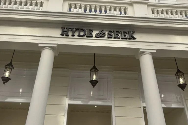The new HYDE & SEEK lettering above the columned entrance at 1 Lancaster Gate.