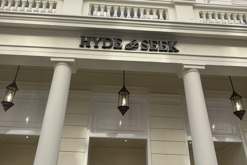 The new HYDE & SEEK lettering above the columned entrance at 1 Lancaster Gate.