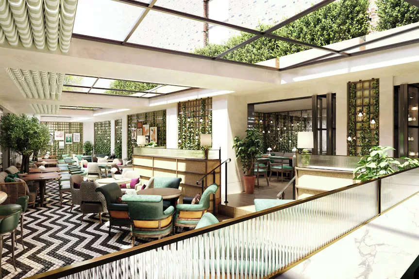 HydeOut, the café lounge, with a glass roof, planted green walls and a chevron floor.